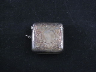 An Edwardian engraved silver vesta case with hinged lid  Birmingham 1906