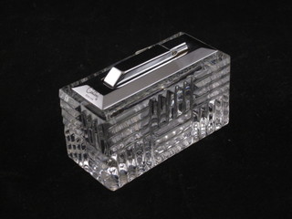 A rectangular glass table lighter
