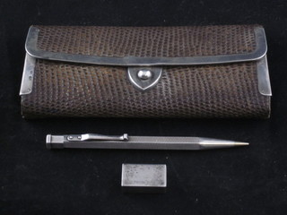 A small silver box marked Tiffany, a snakeskin and silver mounted purse and a silver propelling pencil