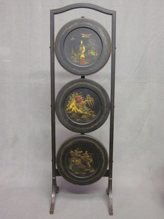 A 1930's circular black lacquered chinoiserie style 3 tier folding cake stand