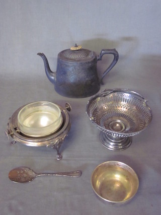 A silver plated roll top butter dish, a circular silver plated dish  and a Britannia metal teapot