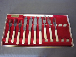 A set of 6 silver plated fish knives and forks (2 knives missing)