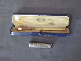 An ivory and 9ct gold cigarette holder together with a silver cheroot holder case