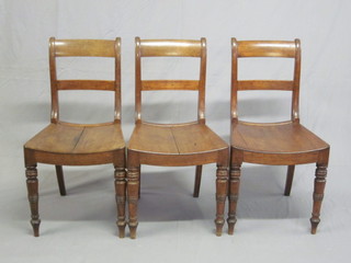 A set of 3 19th Century Country oak bar back dining chairs with solid seats, raised on turned supports