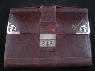 A red leather writing case with silver mounts