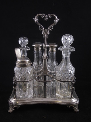 A silver plated cruet frame with 6 cut glass bottles