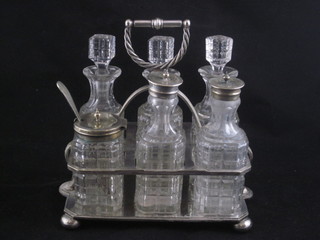 A rectangular silver plated cruet frame with 6 cut glass bottles