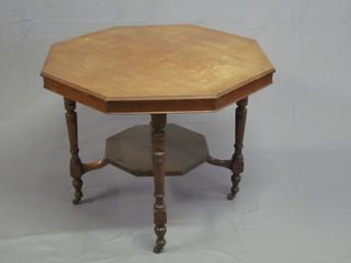 An Edwardian bleached walnut octagonal occasional table, raised on turned supports with undertier, 35"