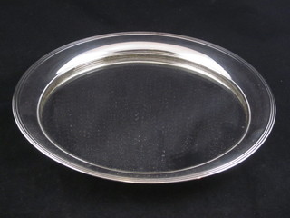 A circular Dutch round tray, the base fitted a mirror 11"
