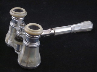 A pair of opera glasses in chromium plated and mother of pearl  case