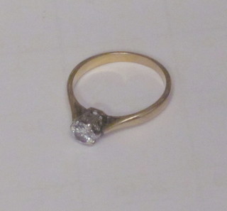A lady's 18ct yellow gold solitaire dress ring set a diamond