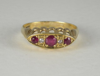 A gold dress ring set rubies and diamonds