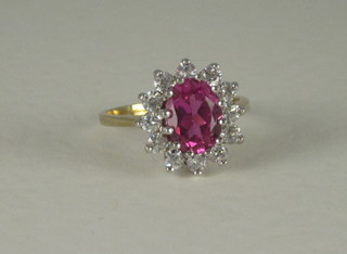 A lady's 18ct yellow gold dress ring set pink and white stones
THIS IS 9CT NOT 18CT AS CATALOGUED