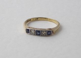 An 18ct yellow gold dress ring set sapphires and diamonds