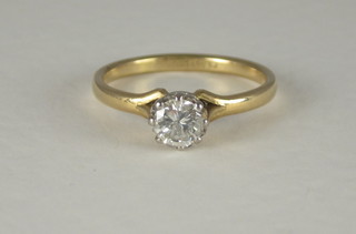 An 18ct yellow gold dress ring set a diamond