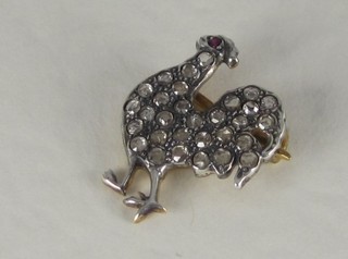 A gold brooch in the form of a cockerel set diamonds and ruby  eyes