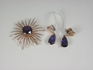 A suite of amethyst jewellery comprising spray brooch and a pair of earrings