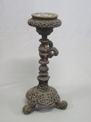 A Victorian carved and pierced Eastern hardwood jardiniere  stand, 40"