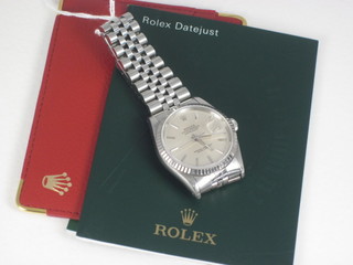 A gentleman's Rolex Day Datejust wristwatch contained in a stainless steel case