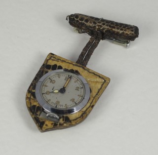 A lady's Swiss brooch watch contained in a snake skin case