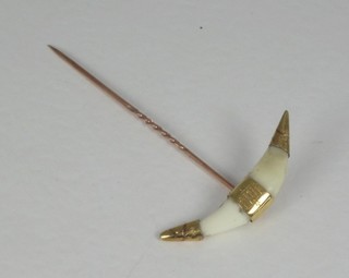 A gold and ivory buffalo stick pin