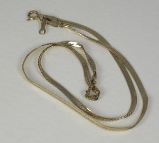 A fine gold flat link chain