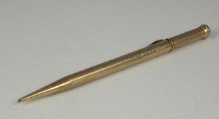 A propelling pencil contained in a 9ct gold case