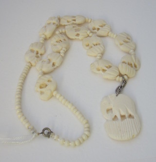 A carved ivory necklace