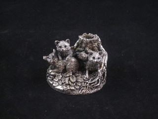 A cast silver model of fox cubs by a tree stump 2"