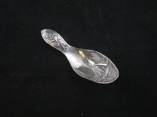 A Dutch embossed silver caddy spoon decorated a boat