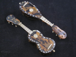 A tortoiseshell model of a mandolin 5" and do. guitar 5"