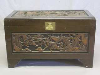 An Eastern carved hardwood camphor coffer with hinged lid 39"
