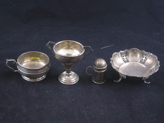 A circular pierced silver dish, miniature silver pepperette, twin handled trophy cup and a salt, 3 ozs