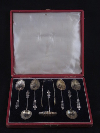 A set of 6 Victorian silver apostle spoons, London 1897,  complete with tongs and sifter spoon, contained in a red leather  case, 2 ozs