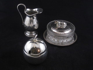 A circular cut glass butter dish, f, with silver plated lid, the finial  in the form of a cow, a silver plated preserve dish and do. jug