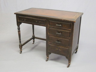 An Edwardian mahogany typists desk with inset writing surface,  fitted 1 long and 4 short drawers, 39"