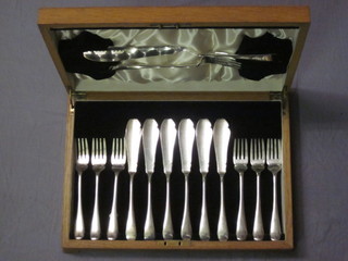 A set of 6 Art Deco silver plated fish knives and forks complete  with servers, contained in an oak canteen box