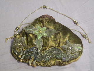 A lady's green fabric evening bag