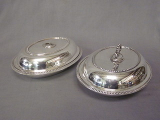 A pair of oval silver plated entree dishes and covers, 1 handle missing