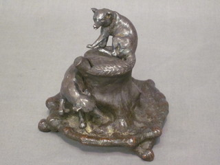 A bronze inkwell in the form of a tree stump with fox hound and seated fox, 4"
