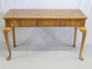 A 19th Century rectangular walnut side table, raised on cabriole  supports 60"