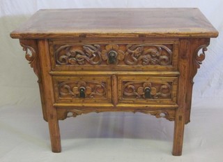 An Oriental carved hardwood cabinet fitted 1 long drawer above  2 short drawers 44"