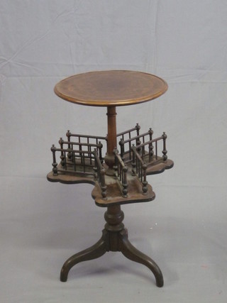 A Victorian circular figured walnut reading table, the upper section with circular top, the base fitted a revolving triform  platform in 3 sections, raised on pillar and tripod supports 15"