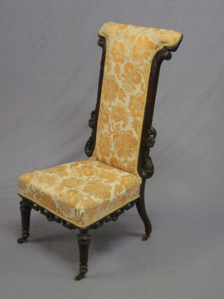 A William IV rosewood show frame Prie Dieu chair, upholstered  in yellow material and raised on turned and fluted supports