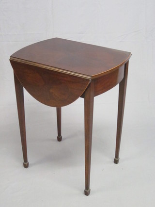 An Edwardian Georgian style oval Pembroke table fitted a  drawer and raised on square tapering supports ending in spade  feet 23"