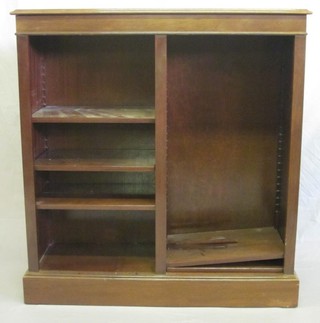 A Victorian style mahogany bookcase fitted adjustable shelves, raised on a platform base 39"