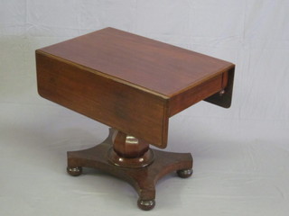 A Victorian mahogany pedestal Pembroke table raised on a  turned column with triform base 35"