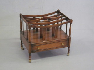 A 19th Century style mahogany 4 division Canterbury, the base fitted a drawer and raised on turned supports 19"