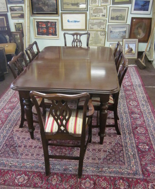 A Georgian style mahogany dining suite comprising extending dining table and 6 Chippendale style slat back dining chairs with  upholstered drop in seats and a breakfront sideboard fitted 4  drawers above 4 cupboards