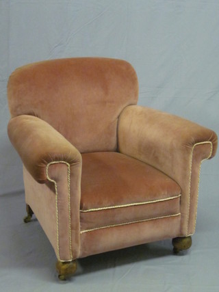 A mahogany framed armchair upholstered in rose pink Dralon